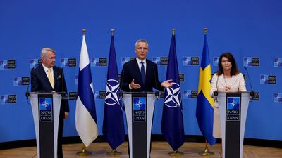Foreign ministers Ann Linde, of Sweden, and Pekka Haavisto, of Finland, attend a news conference with Nato Secretary General Jens Stoltenberg, after signing accession protocols in Brussels. Reuters