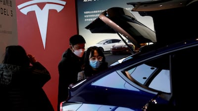 A China-made Tesla Model Y vehicle at the company's showroom in Beijing. The latest price cuts in China mean a 13 per cent to 24 per cent reduction in Tesla's prices from September. Reuters