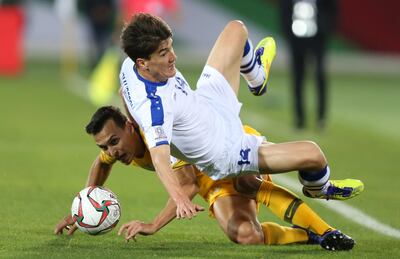 Trent Sainsbury, left, of Australia in action against Eldor Shomurodov of Uzbekistan. EPA