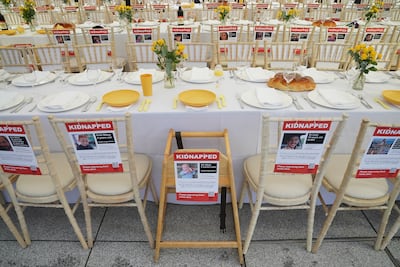 An empty Shabbat table installation in London to highlight the missing Israeli hostages. PA Wire