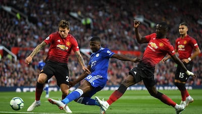 Manchester United's Victor Lindelof tackles Leicester's Kelechi Iheanacho. Getty Images