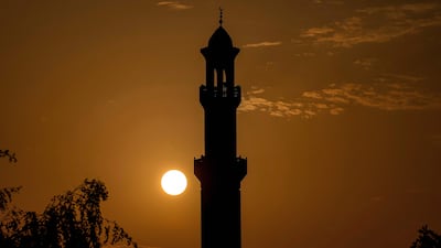 The sun rises behind a minaret in Doha, Qatar. Many Arab countries have found themselves under military attack from Iran. AFP
