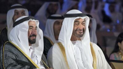 Dr Sheikh Sultan bin Mohamed Al Qasimi, UAE Supreme Council Member and Ruler of Sharjah, left, and Sheikh Mohammed bin Zayed, Crown Prince of Abu Dhabi and Deputy Supreme Commander of the UAE Armed Forces, watch a show titled “This Is The Future”, during the 46th UAE National Day celebrations at Mushrif Palace. Mohamed Al Hammadi / Crown Prince Court - Abu Dhabi