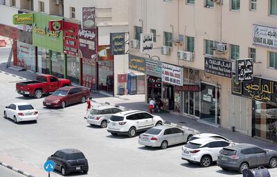 Shops line Sheikh Ammar street in Al Muwaihat area in Ajman. Pawan Singh / The National