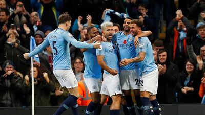 Manchester City's Sergio Aguero celebrates scoring their second goal with teammates. Reuters