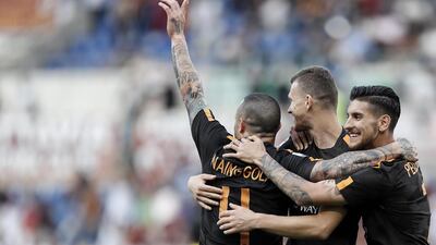 Edin Dzeko, centre, and his Roma side have the momentum to still mount a comeback against Liverpool this week. Riccardo Antimiani / EPA