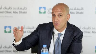 Dr Rakesh Suri, chief executive of Cleveland Clinic Abu Dhabi, speaks during a press conference in February. Dr Suri says Mubadala Healthcare, which Cleveland Clinic is managed by, is working on a referral system which involves having family doctors on the frontlines. Chris Whiteoak / The National