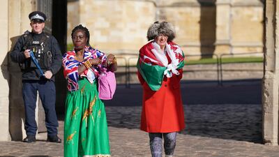 Grace Gogharg and Anne Daley leaving after visiting the inscribed ledger stone. PA