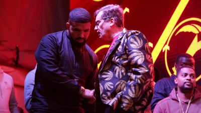 Recording artist Drake and Toronto mayor John Tory greet each other. Reuters