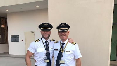 Mr van Gelder poses with his father, Robert, who retired as a captain from the skies in 2019.