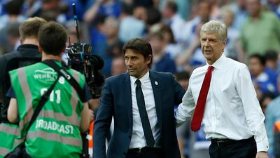 Antonio Conte, left, still remembers the day when Arsene Wenger's Arsenal beat them in the final of the FA Cup. Ian Kington / AFP