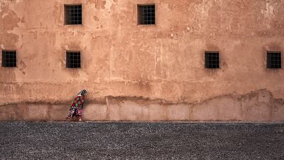 A woman rushes to avoid the heat.