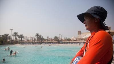 A lifeguard by the wave pool at Yas WaterWorld in Abu Dhabi. Razan Alzayani for The National