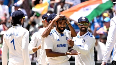 India pacer Jasprit Bumrah celebrates with teammates after dismissing Australia's Alex Carey on the fourth day of the fourth Test in Melbourne. AFP
