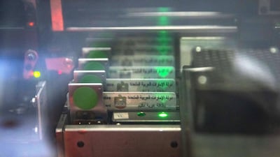 Emirates ID cards under production. Personal data is uploaded to the chip. Victor Besa / The National