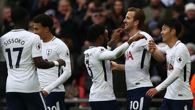 Harry Kane, second right, broke Alan Shearer's record with his first goal against Southampton, before scoring twice more to extend his own record. Neil Hall / EPA