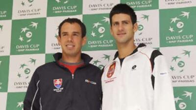 Dominik Hrbaty, left, and Novak Djokovic pose at the end of the draw for of the Davis Cup World Group.