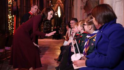 The Princess of Wales speaks with children at the Together at Christmas carol service on Thursday night. AFP