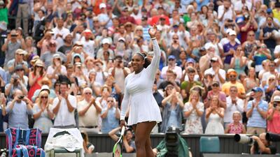 Serena Williams celebrates after beating Evgeniya Rodina to reach the Wimbledon quarter-finals. Toby Melville / Reuters