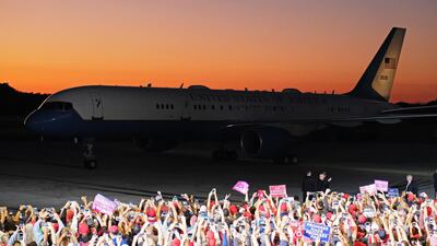 Crowds cheer as Air Force One taxis outside a rally for Donald Trump in Pensacola, Florida. EPA