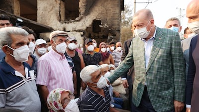 Recep Tayyip Erdogan meets villagers affected by the wildfires in Manavgat. Fires continued in the southern coastal provinces of Adana, Osmaniye, Antalya and Mersin and the western coastal province of Mugla.