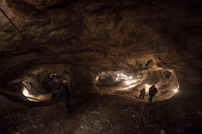Workers come up from the bottom of the Mogok ruby mine gallery. Getty Images