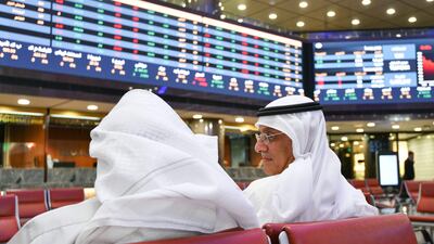 Traders follow stock prices at the Kuwait Stock Exchange in Kuwait City. EPA