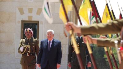 Palestinian president Mahmoud Abbas inspects an honour guard as he arrives to meet with Jordan's King Abdullah II at the Royal Palace in Amman, Jordan. Reuters