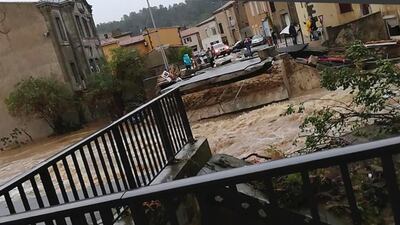 A torrent of water ripped out the bridge in Villegailhenc. AP Photo