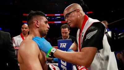Amir Khan is consoled after losing to Terence Crawford. Action Images via Reuters