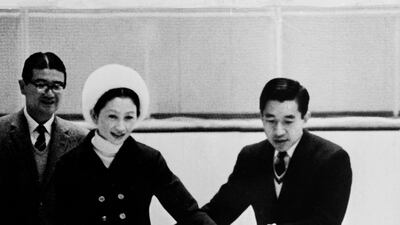 In this file photo taken on February 10, 1971 Japan's Prince Akihito and Princess Michiko skate on the Makomanai speedway in Sapporo. Japan's outgoing Emperor Akihito and Empress Michiko dramatically modernised the tradition-bound monarchy, bringing themselves closer to the public and boosting popular support for the household. AFP
