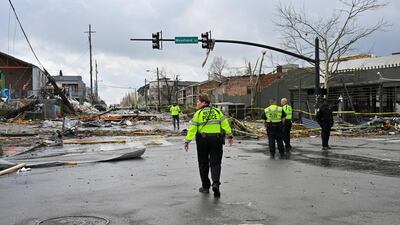 Police officers look at the damage along Woodland Street after a tornado hit eastern Nashville, Tennessee. Reuters