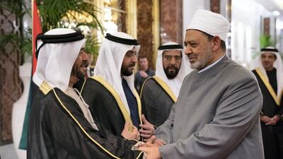 Sheikh Suroor bin Mohamed Al Nahyan greets Dr Ahmad Al Tayyeb at the Presidential Airport. Ryan Carter / Ministry of Presidential Affairs