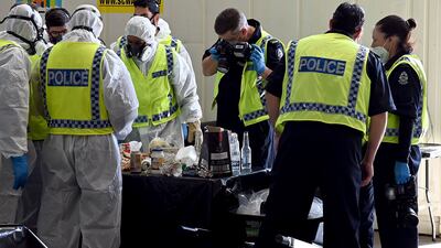 Police search through rubbish collected during their hunt for Cleo. AFP