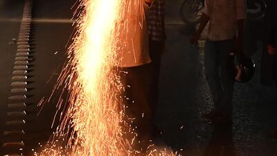 Pakistanis light fireworks. AFP