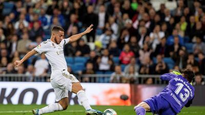 Real Madrid's Eden Hazard attempts to round Leganes' goalkeeper Juan Soriano. EPA