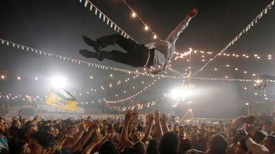 A Palestinian groom is thrown in the air during a mass wedding party for 19 Palestinian couples in the West Bank village of Silwad, near Ramallah, June 28, 2012. The celebration leading up to the mass wedding, which is scheduled to be held on Friday, was attended by Palestinian President Mahmoud Abbas and organised by the Fatah movement. Picture taken June 28, 2012. REUTERS/Mohamad Torokman