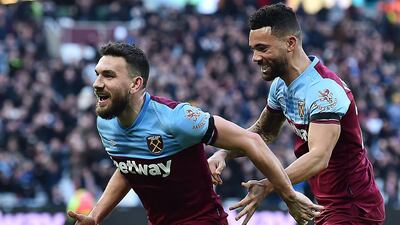 West Ham United's Robert Snodgrass, left, celebrates scoring his team's second goal against Brighton