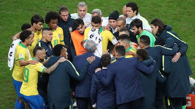 Brazil's team huddles before the penalty shoot-out. AP Photo