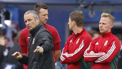 Hungary coach Bernd Storck, left, puts his players through their paces ahead of their Euro 2016 opener against Austria. Regis Duvignau / Reuters