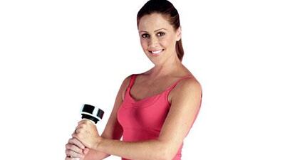 Woman holding a Shake Weight.