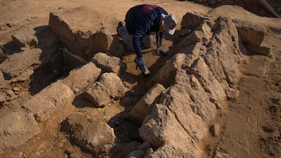 A member of a Palestinian excavation team works in a newly discovered Roman era cemetery in the Gaza Strip, Sunday, Dec. 11, 2022. Hamas authorities in Gaza announced the discovery of over 60 tombs in the ancient burial site. Work crews have been excavating the site since it was discovered last January during preparations for an Egyptian-funded housing project. (AP Photo / Fatima Shbair)
