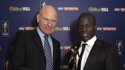 Chelsea Midfielder N'Golo Kante is presented with the FWA Player of the Year Award by Football Writers' Association chairman Patrick Barclay, at The Landmark Hotel on May 18, 2017 in London, England. Neil P Mockford / Getty Images