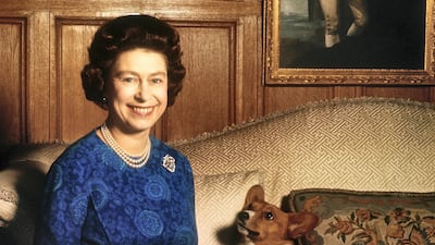 Queen Elizabeth smiles during a picture-taking session in the salon at Sandringham House in 1970. Getty Images