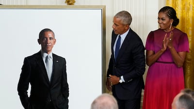 Mr Obama quipped that he resisted wearing a tan suit for his portrait. AP