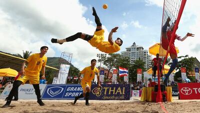 Phakpong Dejaroen of Thailand plays a shot during the Men’s Beach Sepaktakraw Regu final between Indonesia and Thailand during the 2014 Asian Beach Games at Patong Beach in Phuket, Thailand. Cameron Spencer / Getty