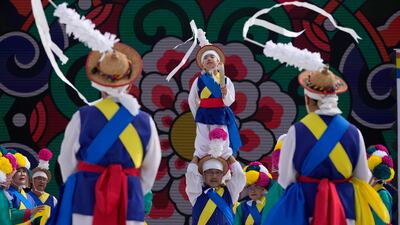 Performers take to the stage outside the venue for the Asia-Pacific Economic Cooperation (APEC) CEO summit in Gyeongju, South Korea. AP Photo