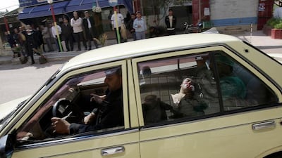 A fatally injured man lies in the back of a vehicle as he is rushed to a hospital in Deraa, the city south of Damascus where the Syrian conflict erupted in 2011. Anwar Amro / AFP