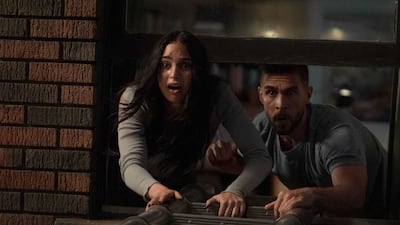 Melissa Barrera as Sam Carpenter and Josh Segarra as David Brackett