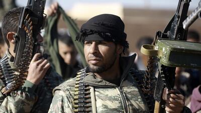 Fighters from the Kurdish-Arab alliance, known as the Syrian Democratic Forces, prepare for an assault on the ISIL bastion of Raqqa in a village of Aliyah on the outskirts of jihadi stronghold on December 10, 2016. A US-backed alliance of Arab and Kurdish fighters announced "phase two" of its campaign for the Islamic State group's Syrian bastion of Raqa. / AFP / DELIL SOULEIMAN
